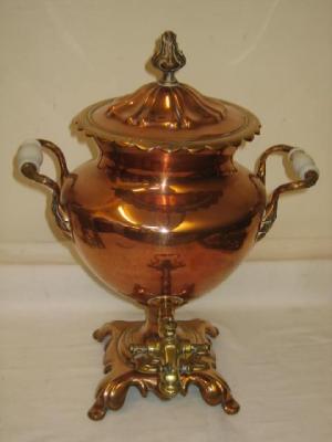 Appraisal: A COPPER AND BRASS TEA URN of baluster form with