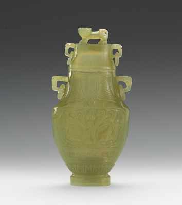 Appraisal: A Carved Hardstone Vase with Lid Carved in archaic style