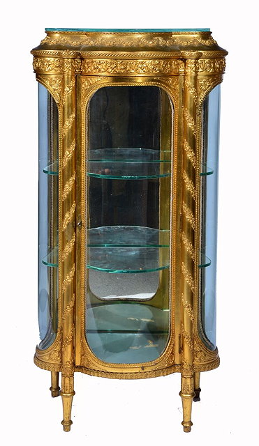 Appraisal: A TH CENTURY FRENCH GILDED VITRINE with two foliate columns