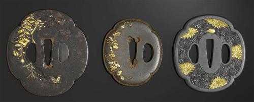 Appraisal: TSUBA Japan th century H cm Mokko form Shibuichi with