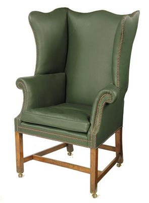 Appraisal: A George III wing armchair with later leather upholstery on