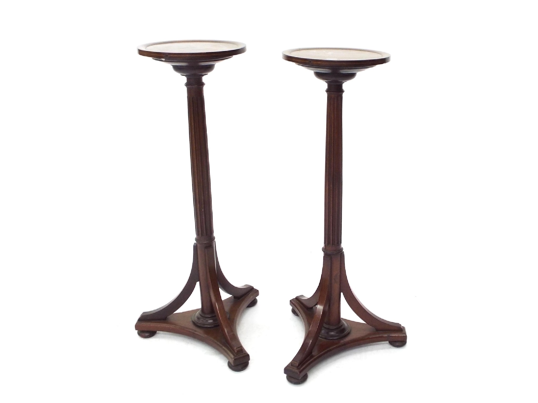 Appraisal: Pair of mahogany torcheres the circular tops upon Corinthian columns