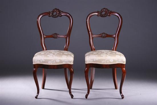 Appraisal: PAIR ROCOCO REVIVAL FRUITWOOD SIDE CHAIRS Early th century Rocaille-carved