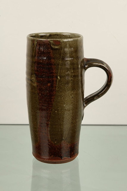 Appraisal: Henry Hammond British - Tall mugtenmoku and poured glazeimpressed potter's