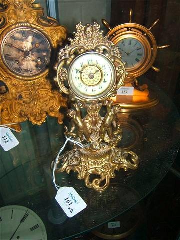 Appraisal: A late Victorian cast gilt brass timepiece the gilt dial