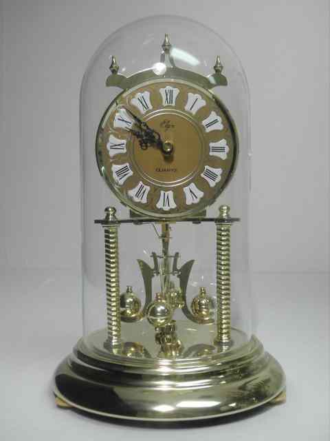 Appraisal: Elgin brass anniversary clock with a glass dome cover Quartz