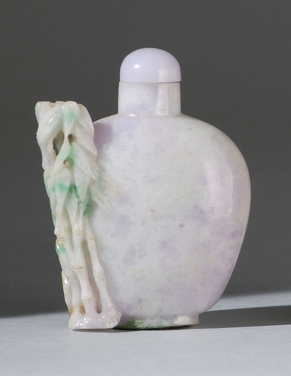 Appraisal: LAVENDER JADE SNUFF BOTTLE In flattened ovoid form with applied