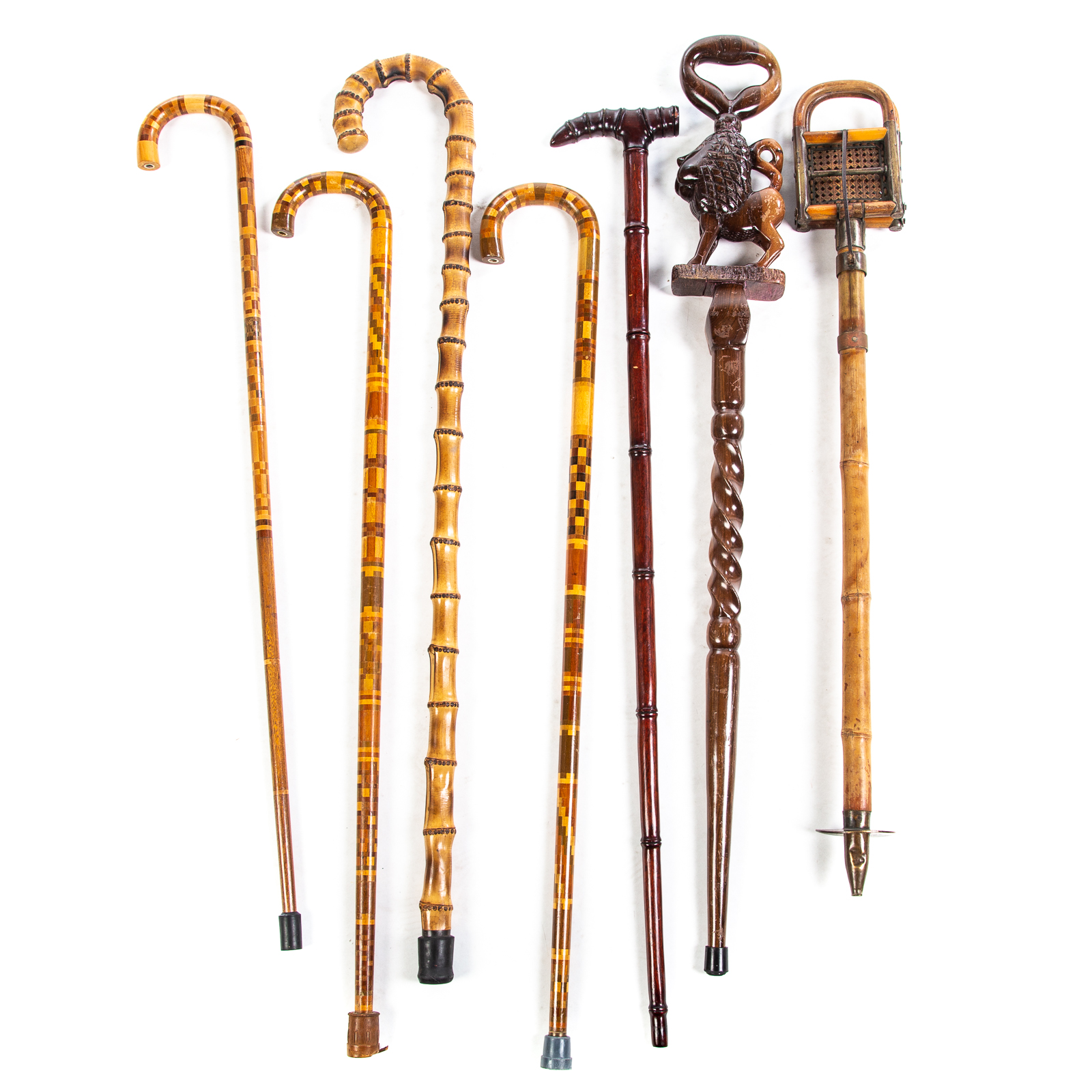 Appraisal: SEVEN ASSORTED CANES Includes carved wood noble lion with twist