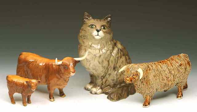 Appraisal: A BESWICK MODEL of a seated cat high and a