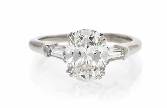 Appraisal: A Platinum and Diamond Ring Harry Winston containing one oval