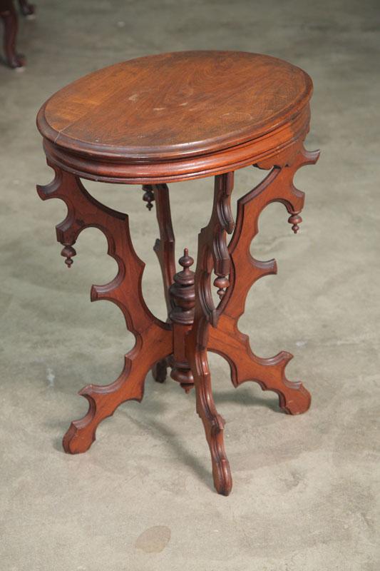 Appraisal: PARLOR TABLE Walnut with an oval top and a bottom