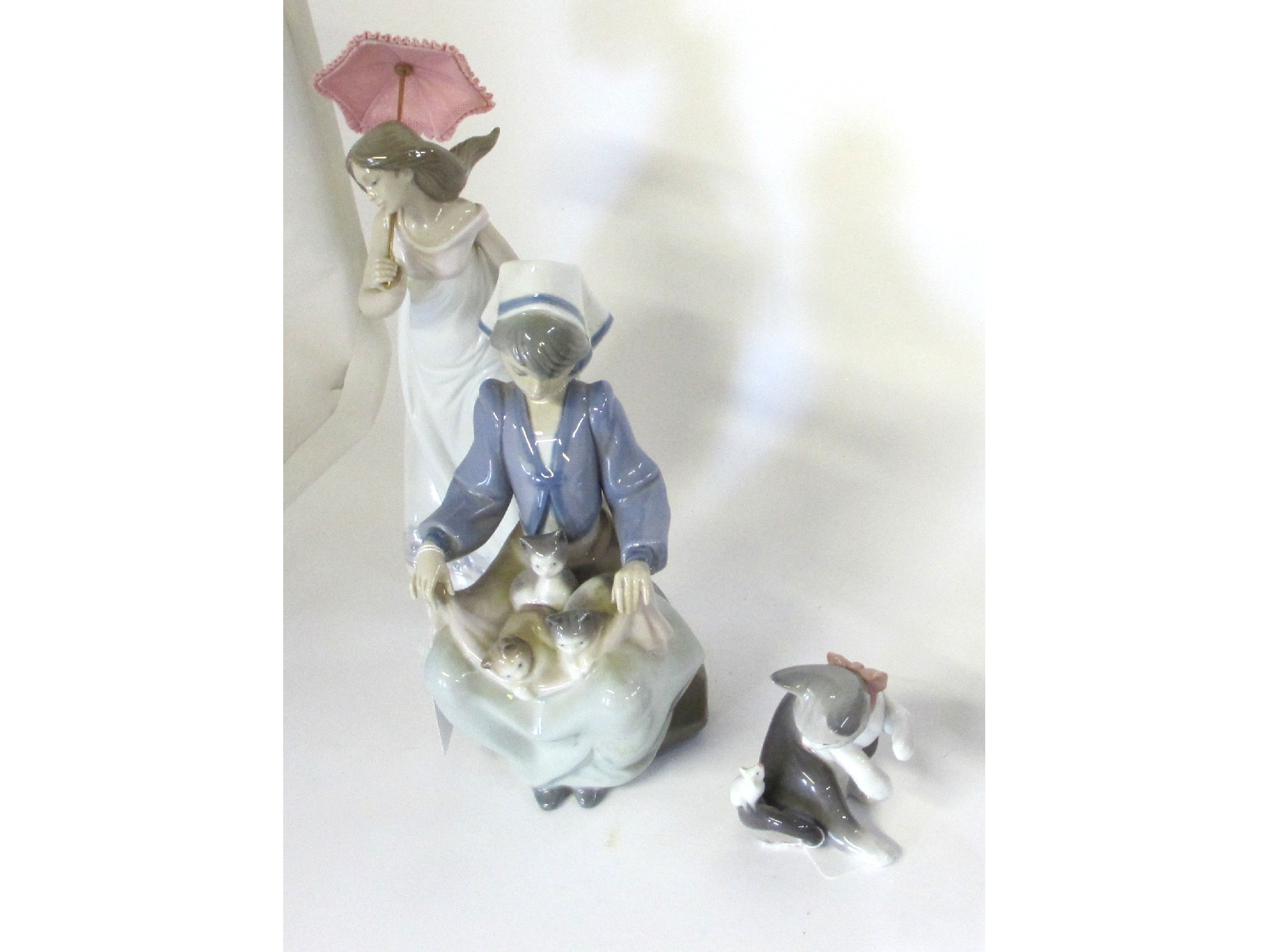 Appraisal: Four Lladro figures to include Afternoon Promenade Cat and Mouse