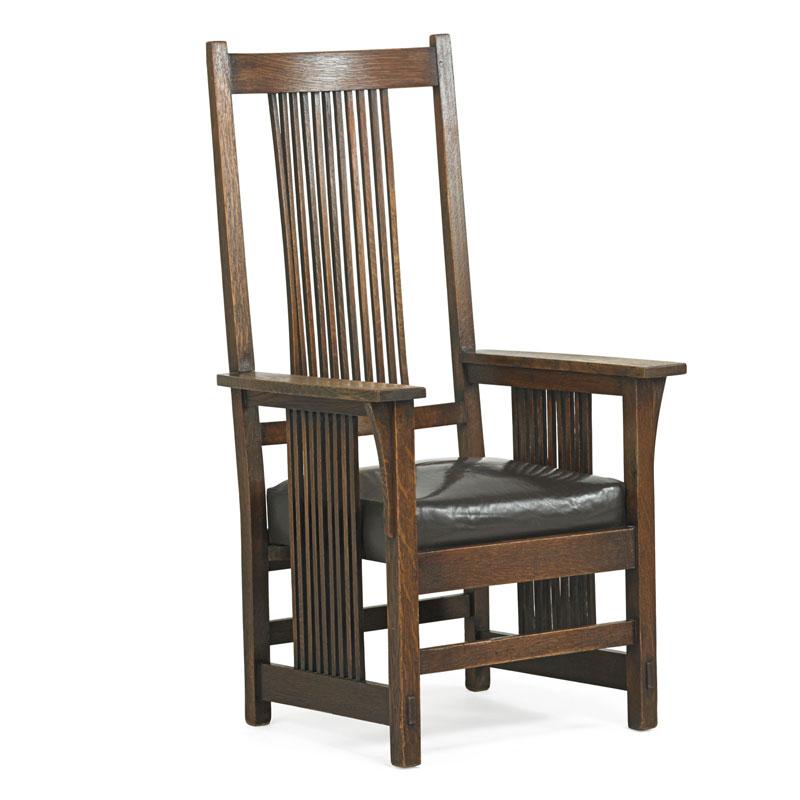 Appraisal: GUSTAV STICKLEY Spindle armchair Condition Report Some looseness overall Four