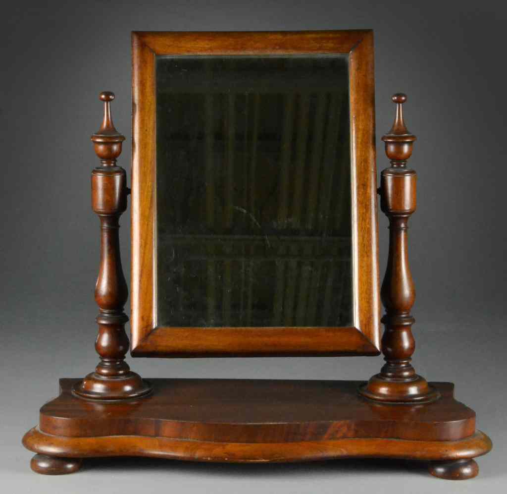 Appraisal: Antique Mahogany Shaving MirrorMahogany rectangular mirror flanked by turned columns