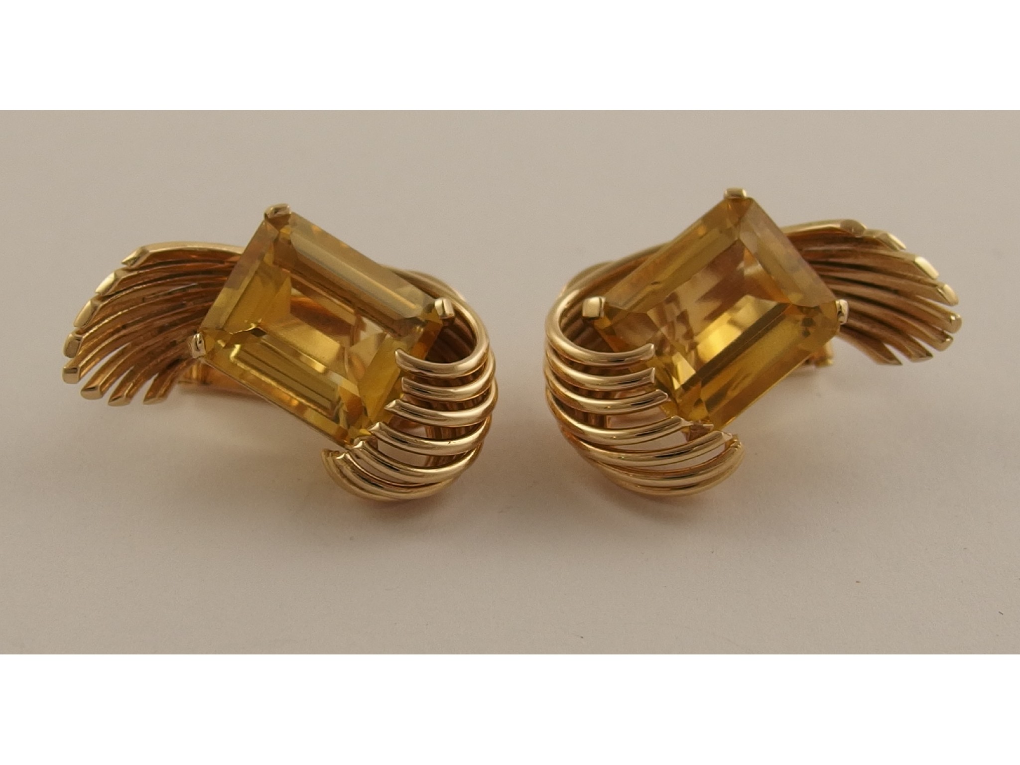 Appraisal: A pair of retro ct yellow gold earringsset with emerald