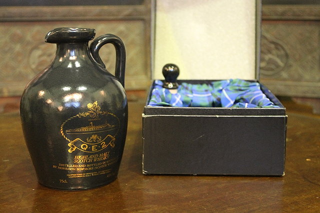 Appraisal: A STONEWARE FLAGON containing Highland Malt Scotch Whisky by Morrison