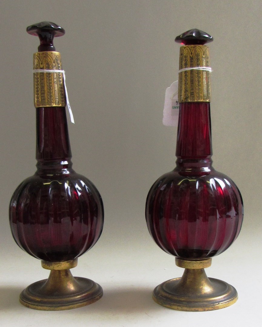 Appraisal: A pair of ruby glass bottles and stoppers th century