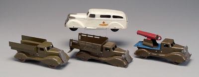 Appraisal: Four Wyandotte trucks white ambulance in three khaki-painted trucks unmarked