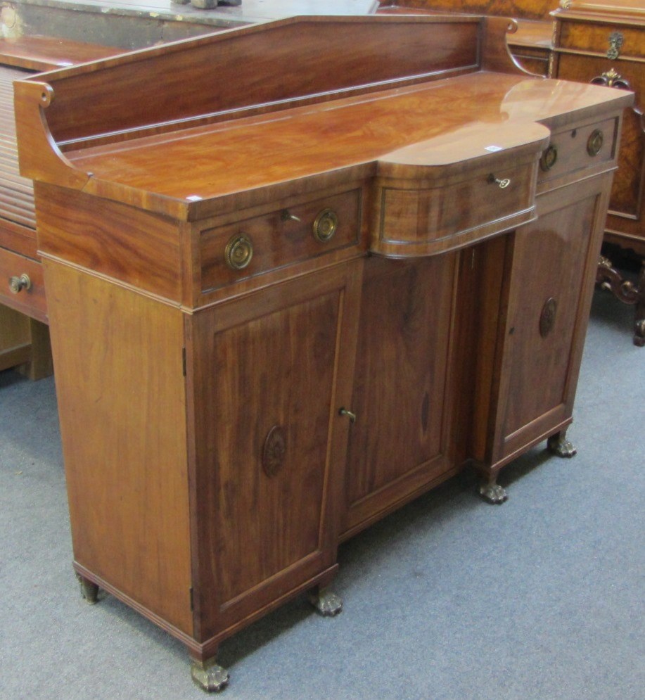 Appraisal: An early th century breakfront mahogany sideboard on gilt metal