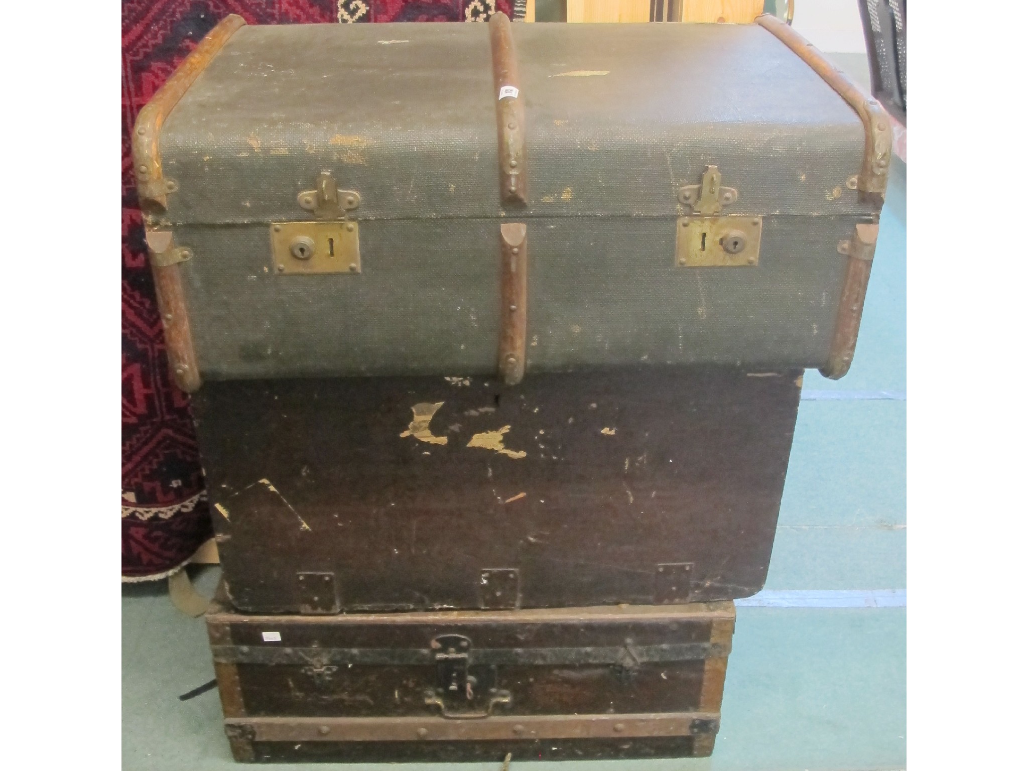 Appraisal: A brass bound travel trunk and two others