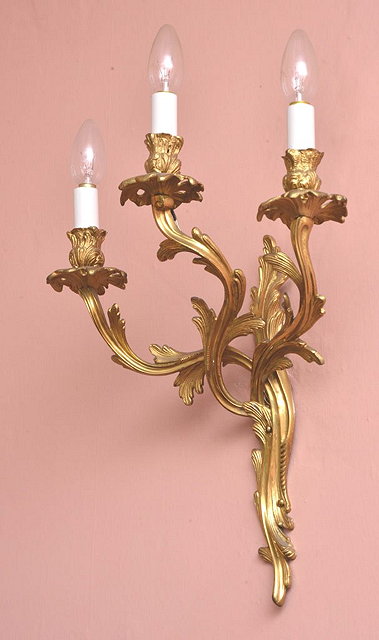 Appraisal: A PAIR OF FRENCH GILT METAL THREE BRANCH ASYMMETRIC WALL