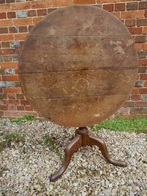 Appraisal: A GEORGE III COUNTRY MADE OAK TILT TOP TABLE the