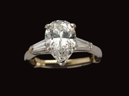 Appraisal: Platinum and diamond ring Approximately carat pear shaped diamond flanked