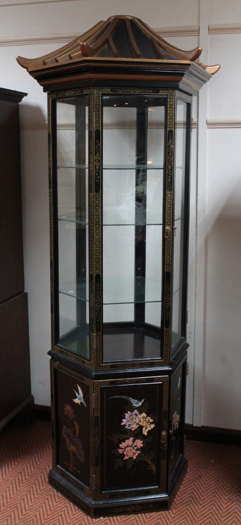 Appraisal: A thC oriental design lacquer finish display cabinet with shaped