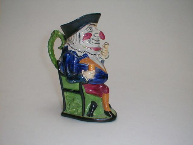 Appraisal: A Portobelloware Toby Jug of Mr Punch smoking AF