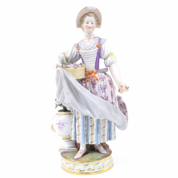 Appraisal: A Meissen porcelain figure of a maiden underglaze blue crossed