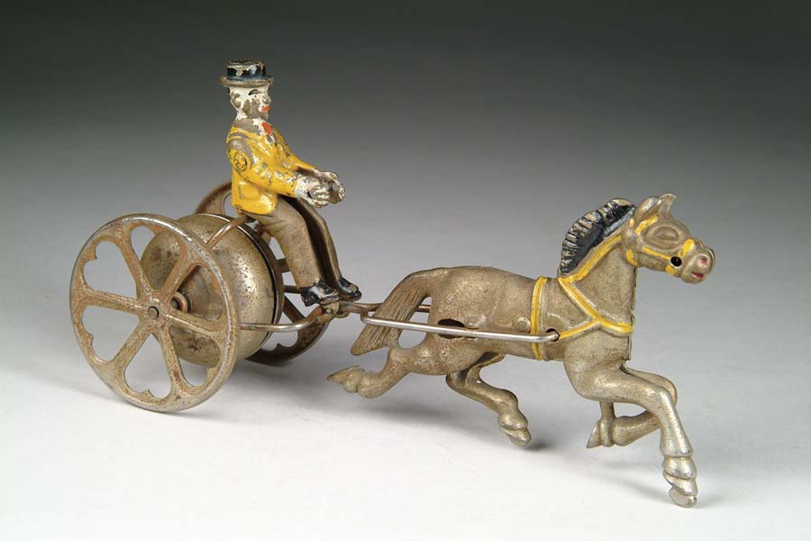 Appraisal: HORSE AND DRIVER BELL TOY Manufactured by Watrous Mfg Co