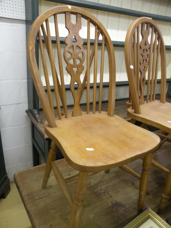 Appraisal: A set of six pine wheelback dining chairs an oak