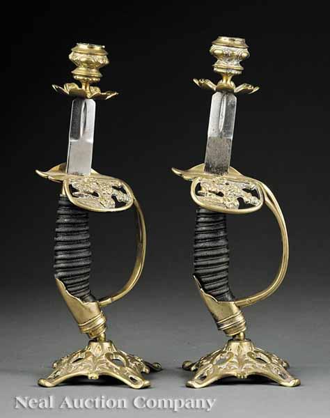 Appraisal: A Pair of English Candlesticks Fashioned from Sword Hilts c