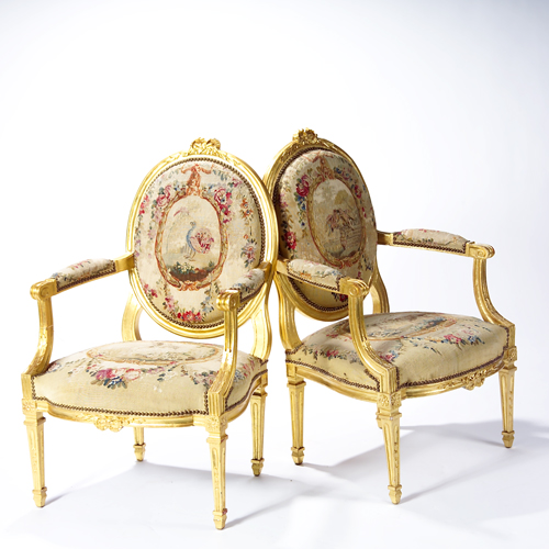 Appraisal: Louis XVI style open armed chairs upholstered in th c