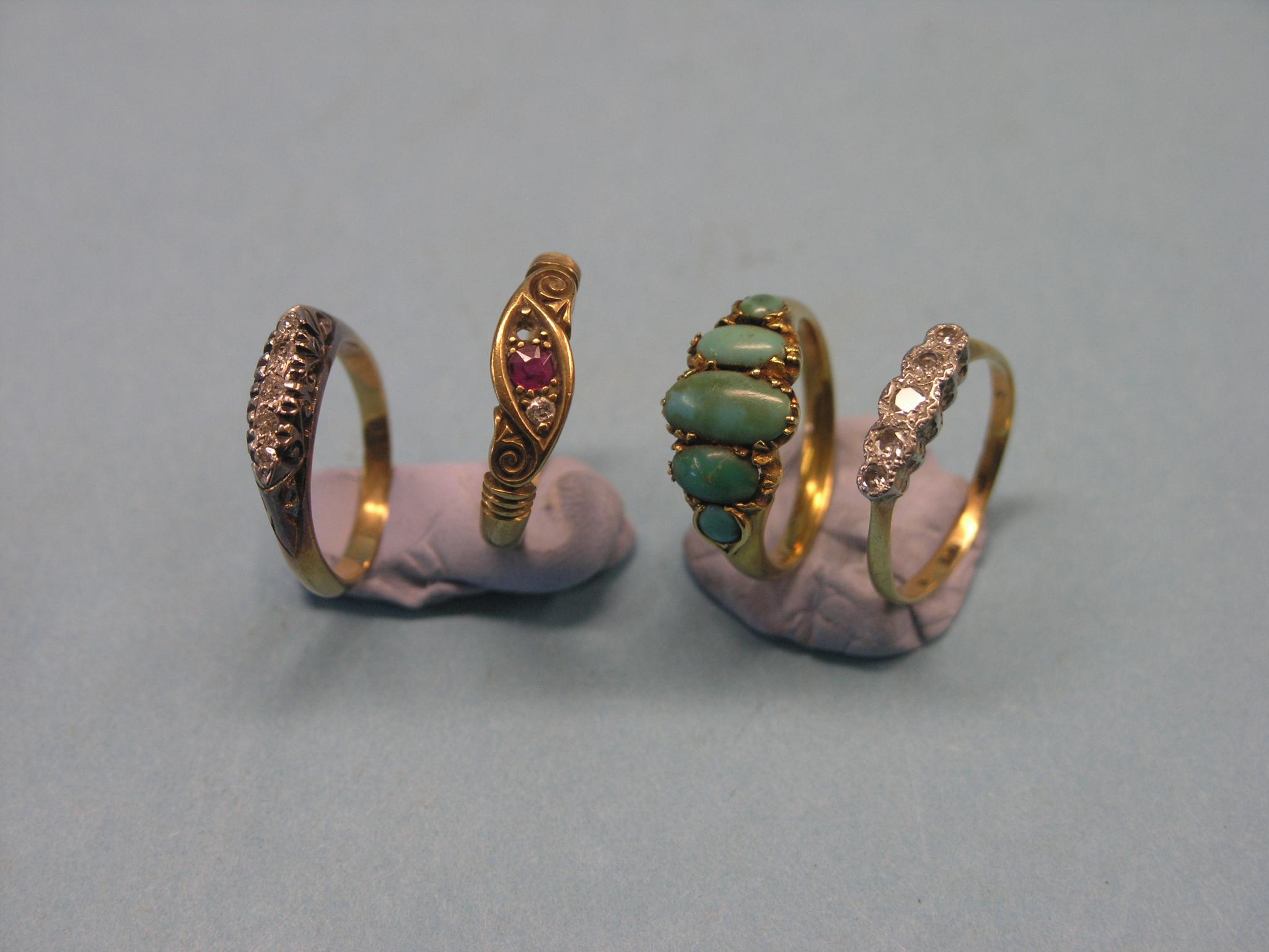 Appraisal: Four various gold-yellow metal rings all set with various stones