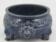 Appraisal: A blue ceramic bowl on three sturdy feet the body