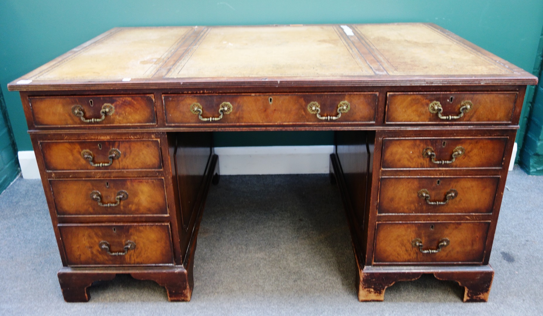 Appraisal: An th century style mahogany nine drawer pedestal desk on