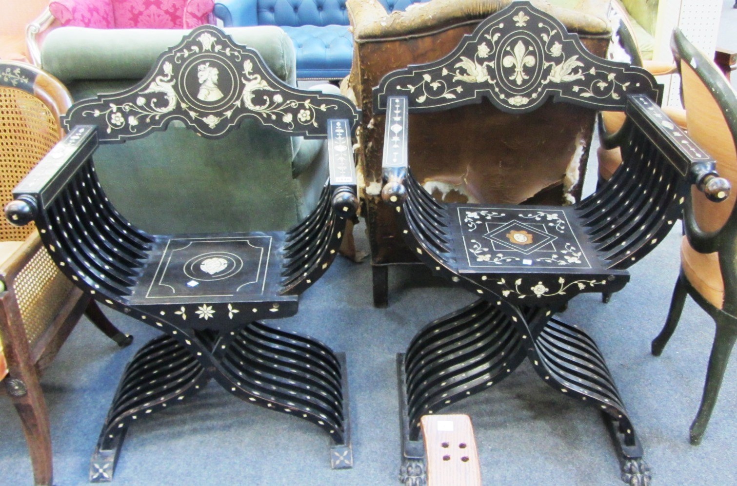 Appraisal: A near pair of bone inlaid ebonised Savonarola chairs