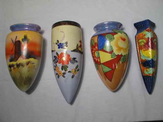 Appraisal: Group lot assorted hand painted wall pockets in the style