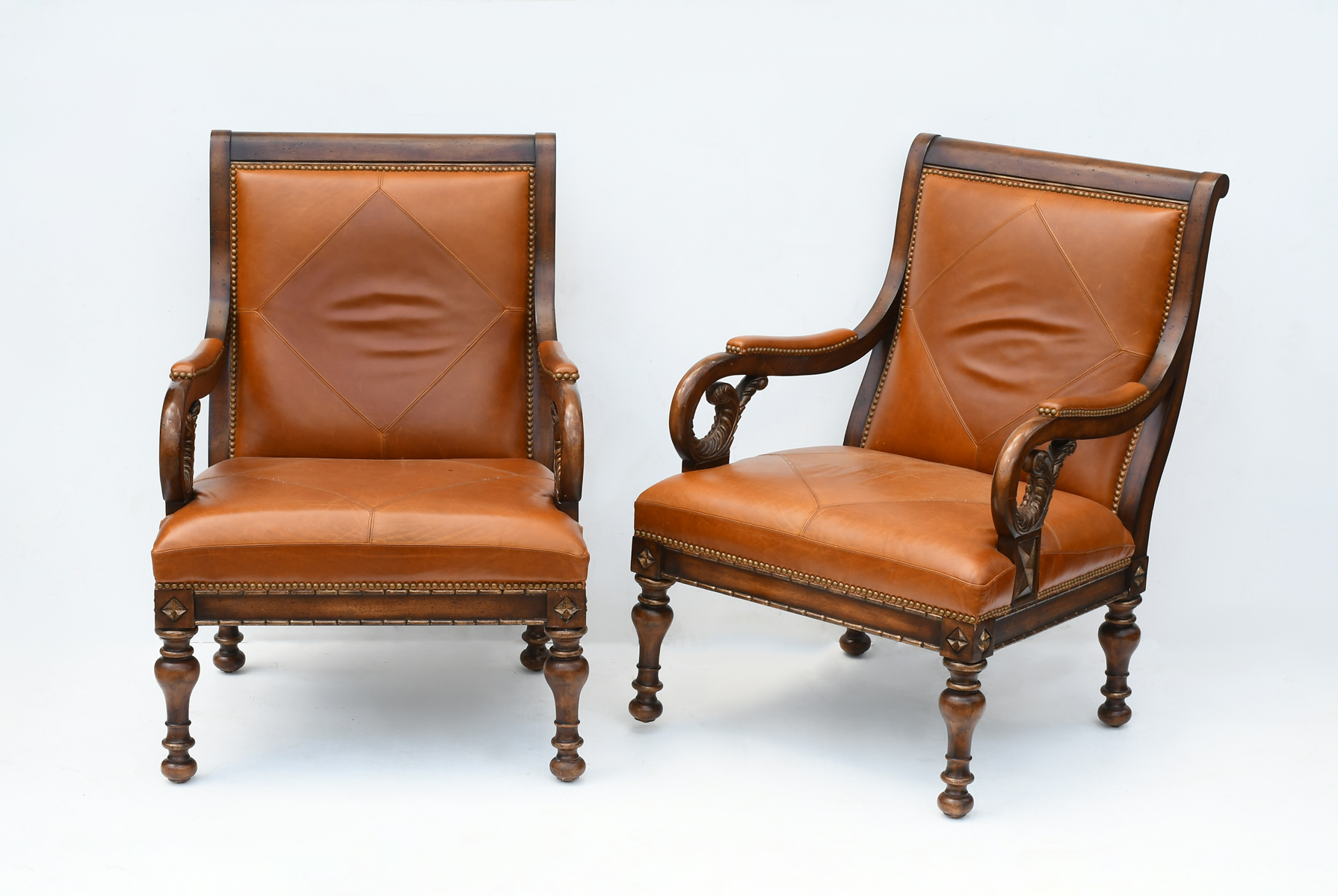 Appraisal: PAIR OF CONTEMPORARY LEATHER ARMCHAIRS Butterscotch leather upholstered armchairs with