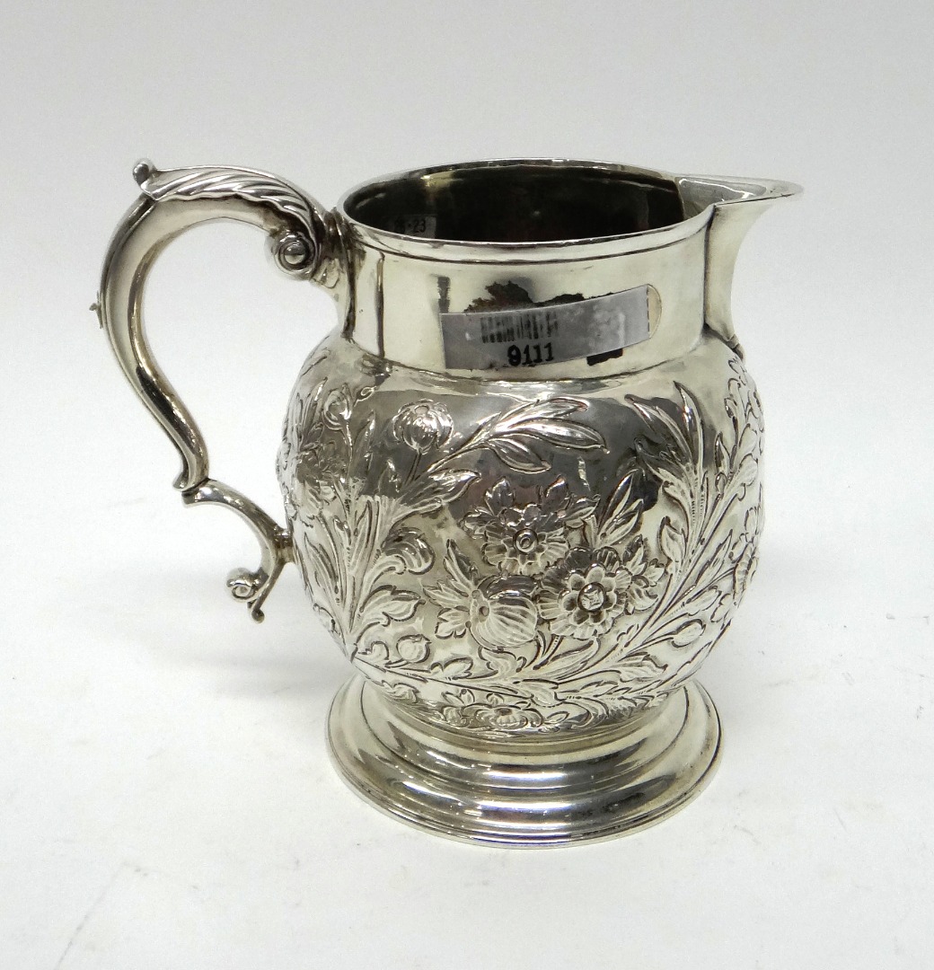 Appraisal: A jug as converted from a mug the body embossed