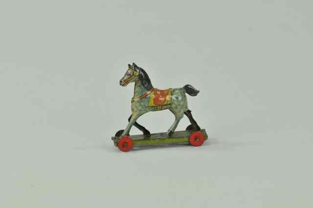 Appraisal: HORSE ON WHEELS PENNY TOY Germany lithographed tin Walking Horse