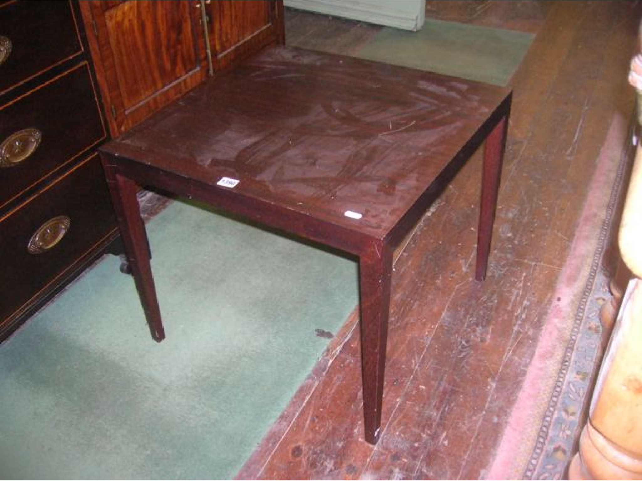 Appraisal: A simple teak occasional table of square cut form and