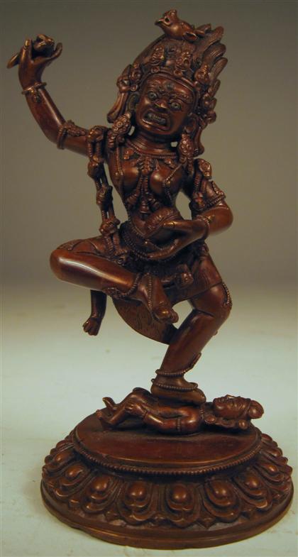 Appraisal: Nepalese or Indian copper deityTwo part casting standing female demonic