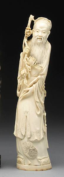 Appraisal: An ivory figure of a sage Standing in long robes