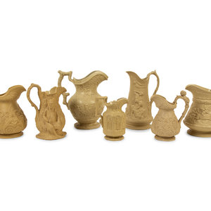 Appraisal: A Collection of Seven English Salt Glazed Relief Form Pitchers