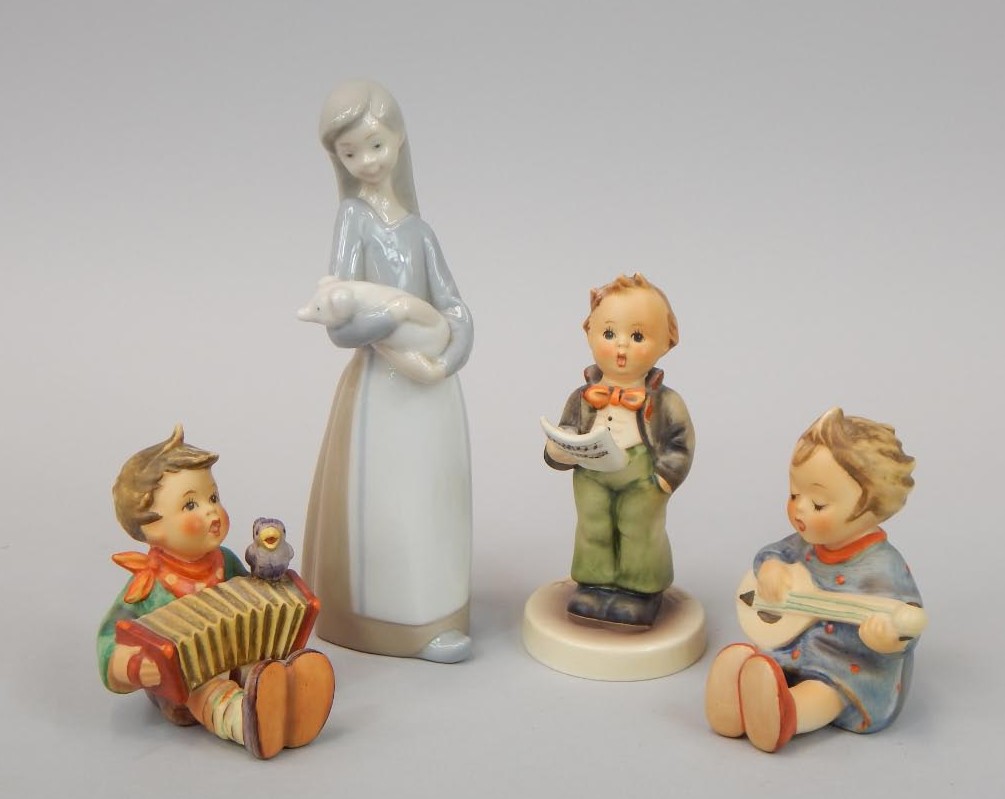 Appraisal: Four ceramic figures a Lladro figure of girl with a