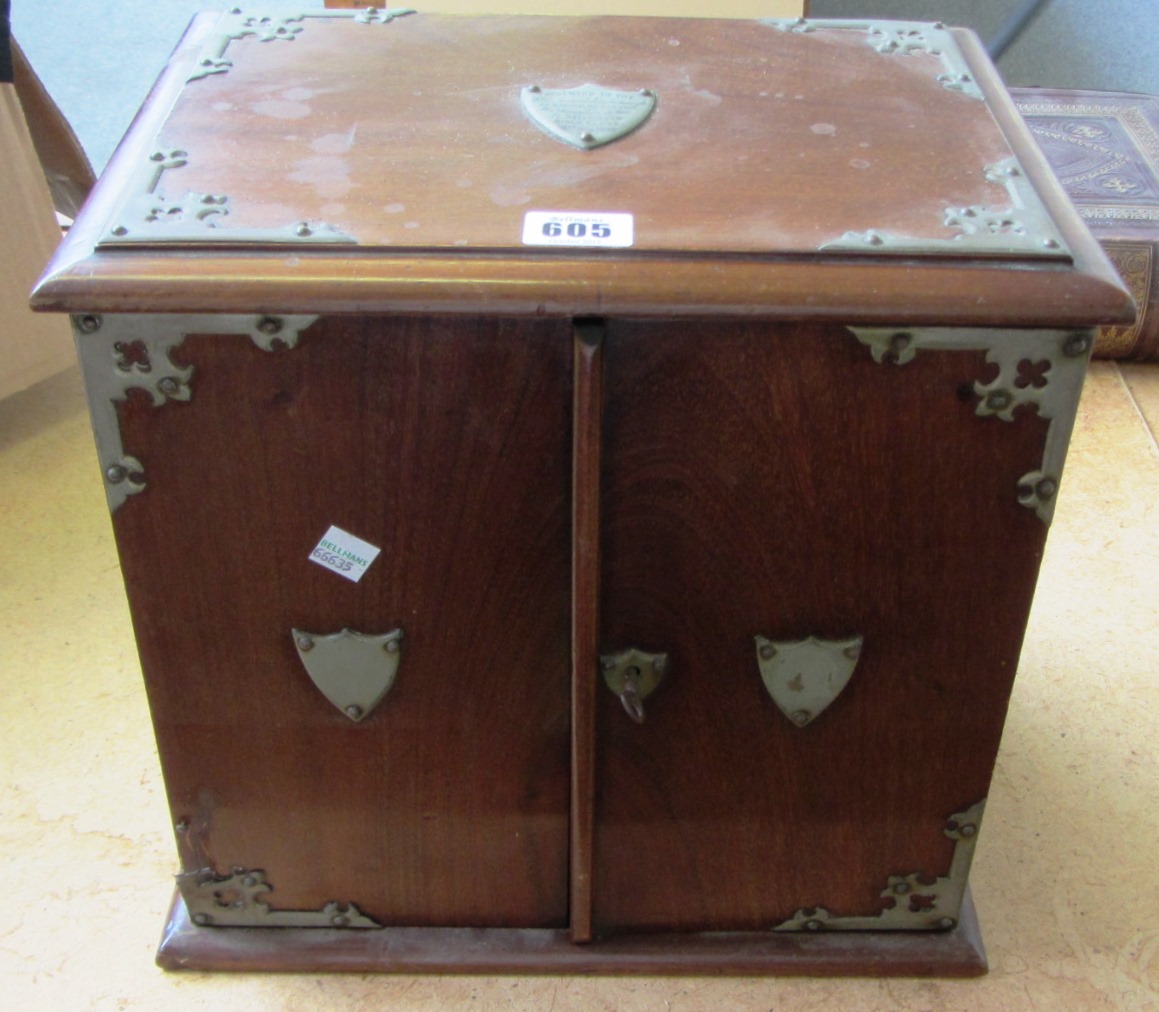 Appraisal: An early th century metal bound mahogany two door smokers