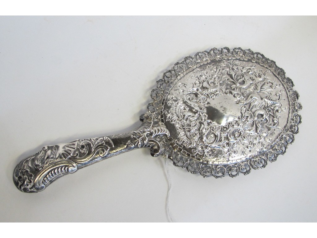 Appraisal: White metal hand mirror embossed with a mythical beast scrolls