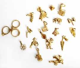 Appraisal: A collection of eighteen assorted ct gold charms gms